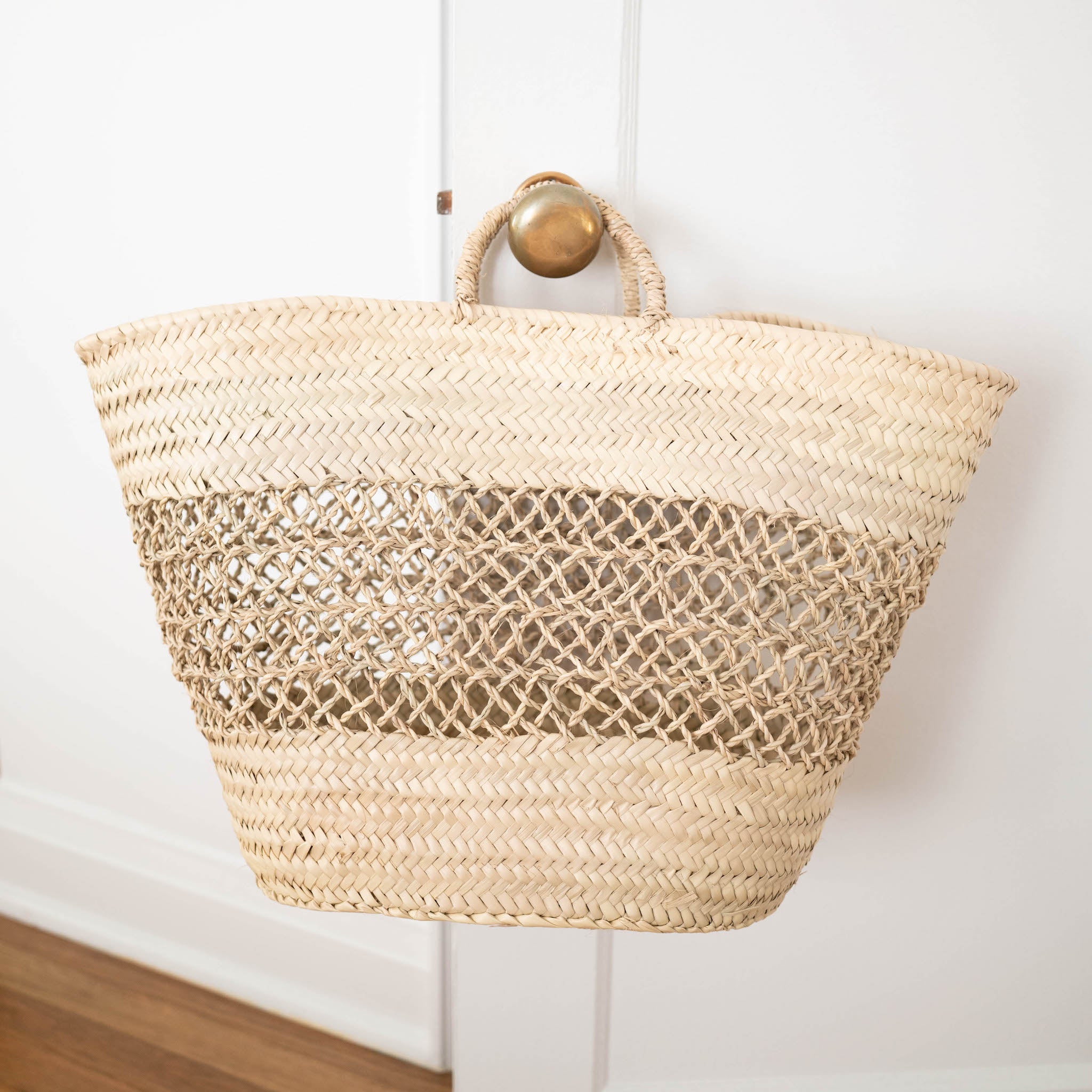 handwoven open weave market basket with handles