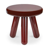 Round brown stool with four legs on a white background