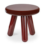Round brown stool with four legs on a white background