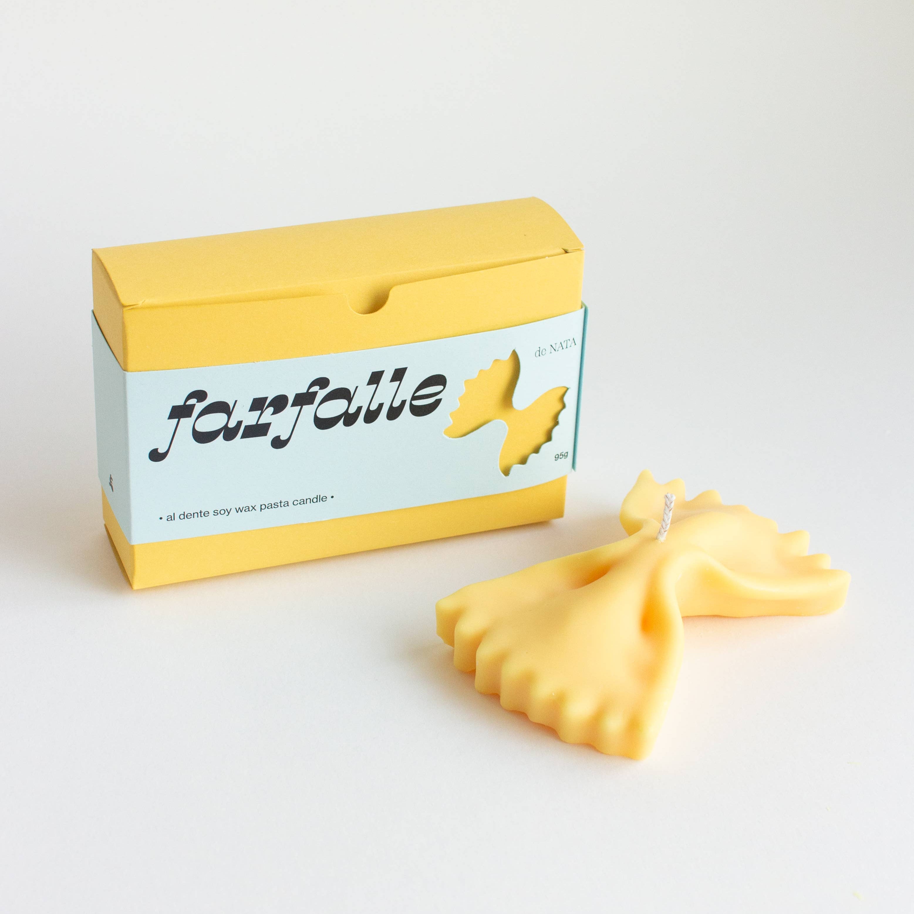 Yellow box of fanfalle pasta on a white background