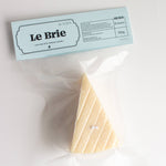 Packaged cheese with 'Le Brie' label on a white background