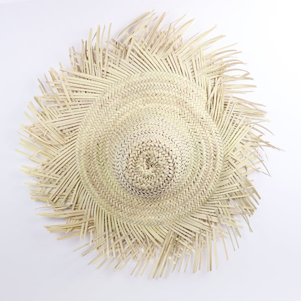 large criss cross fringed decorative handwoven straw hat