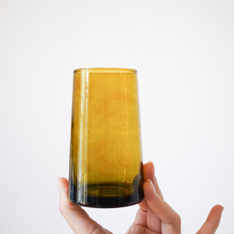 amber recycled glass tapered tumbler in hand