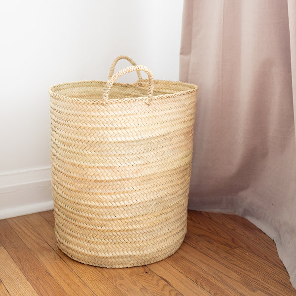 cylindrical handwoven straw basket with straps