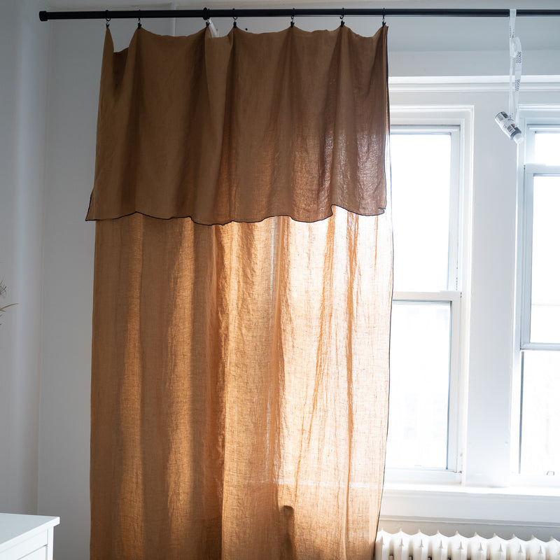 camel linen clip on curtain with black edge