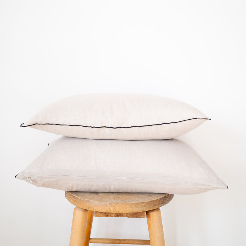 pair of natural linen lumbar pillow with black edge