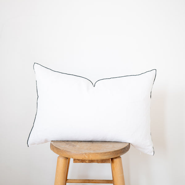 white linen lumbar pillow with black edge