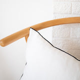 white linen lumbar pillow with black edge