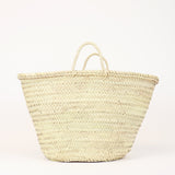 large handwoven straw market basket with straps