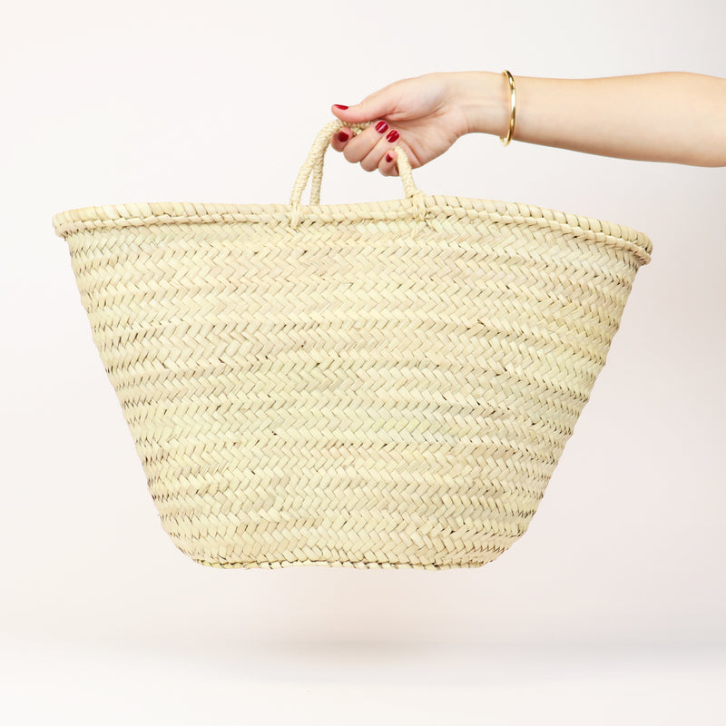 handwoven straw market basket with straps