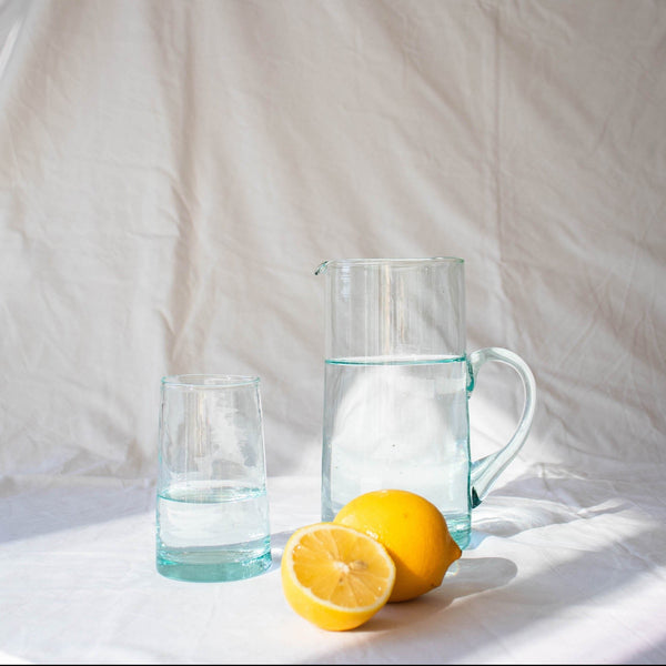 tall clear recycled glass jug with spout and handle and matching tumbler
