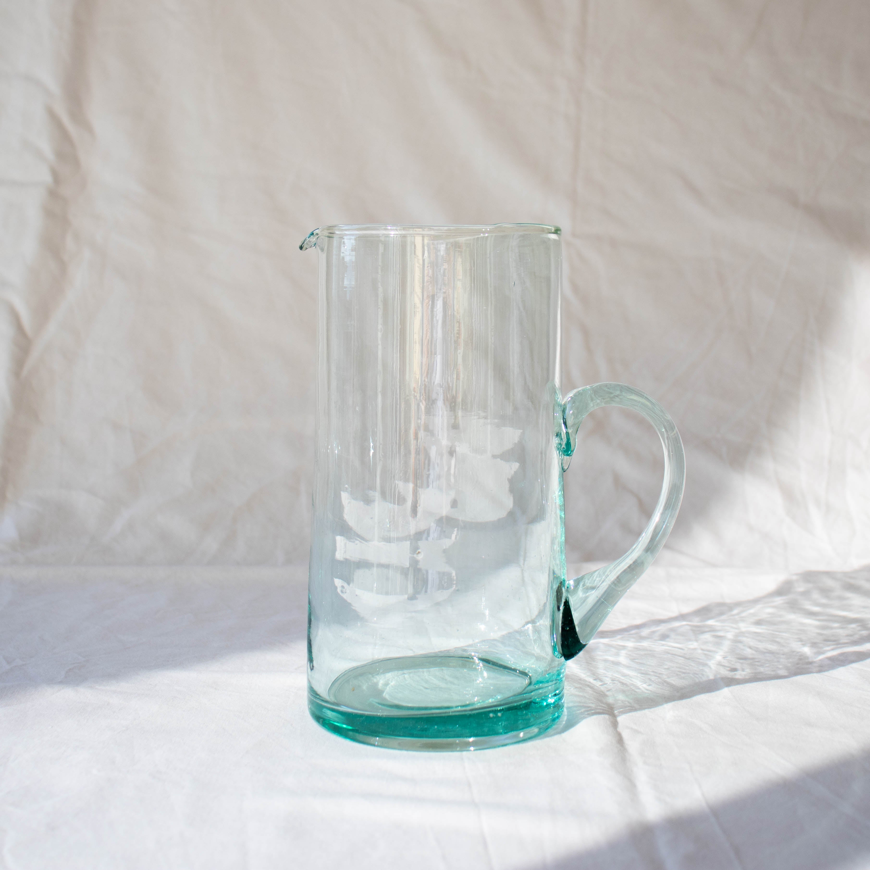 tall clear recycled glass jug with spout and handle