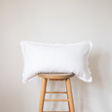 white fringed linen lumbar pillow