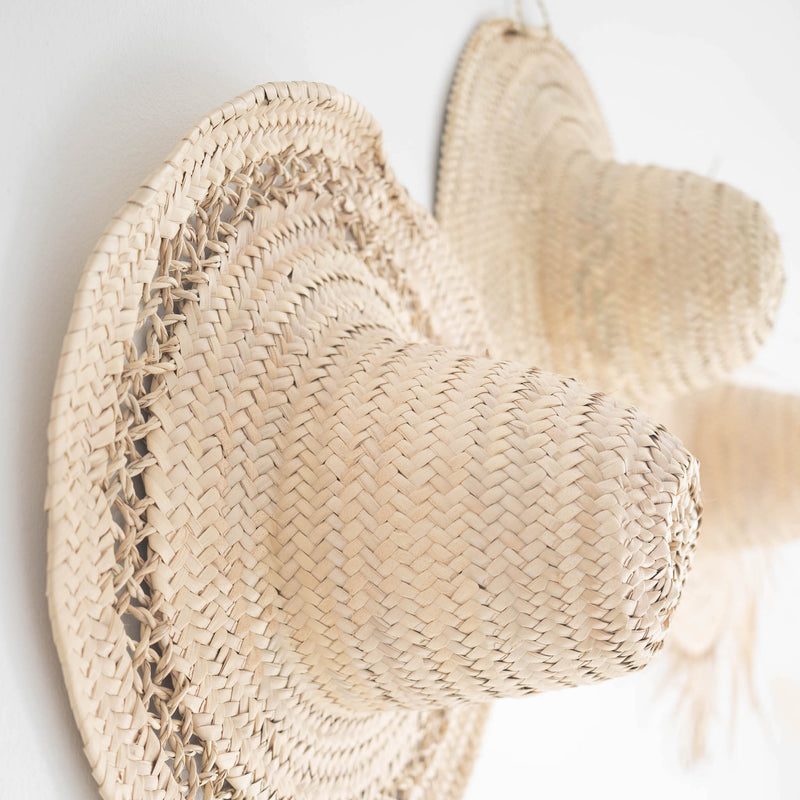 decorative handwoven straw hat with open weave