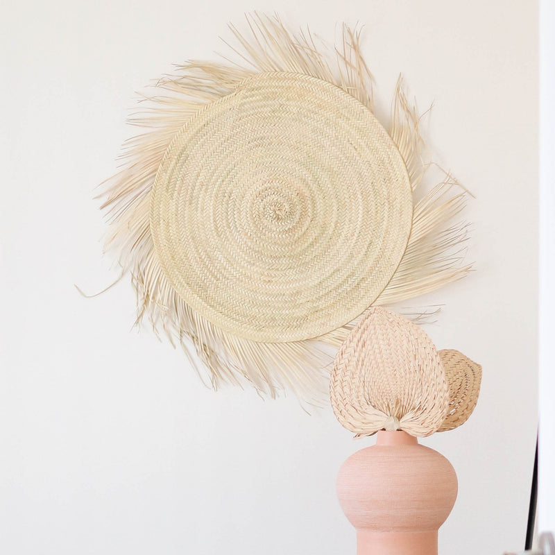 sun shaped handwoven straw wall decor
