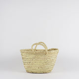 small handwoven straw market basket with straps
